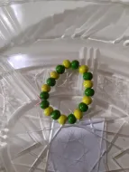 Green and yellow childs bracelet wooden